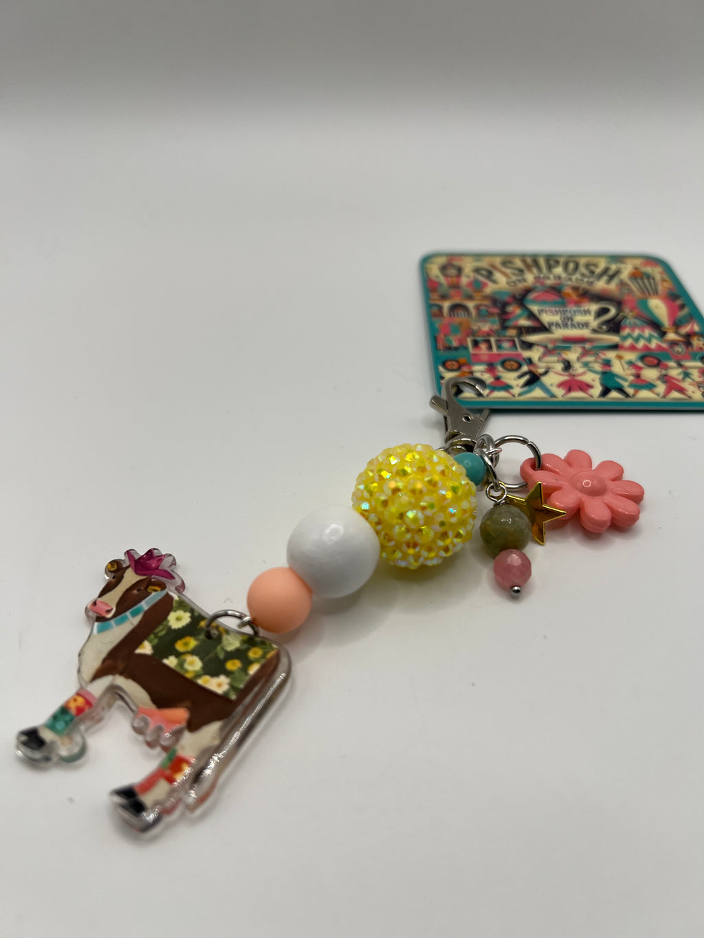 Brown cow with yellow bead