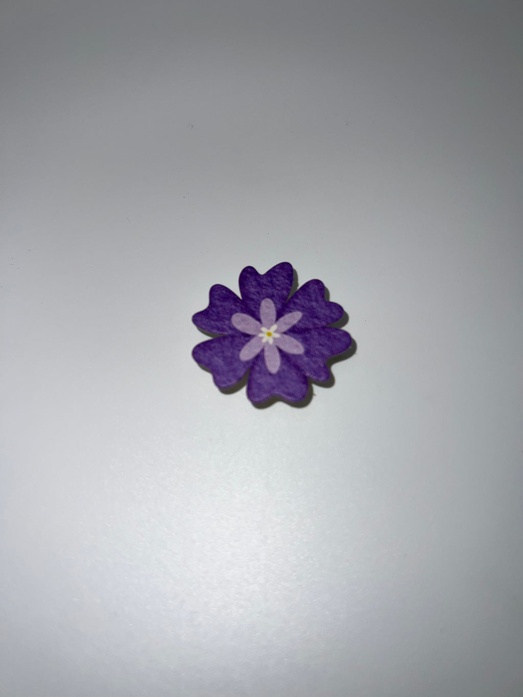 Purple flower needle minder