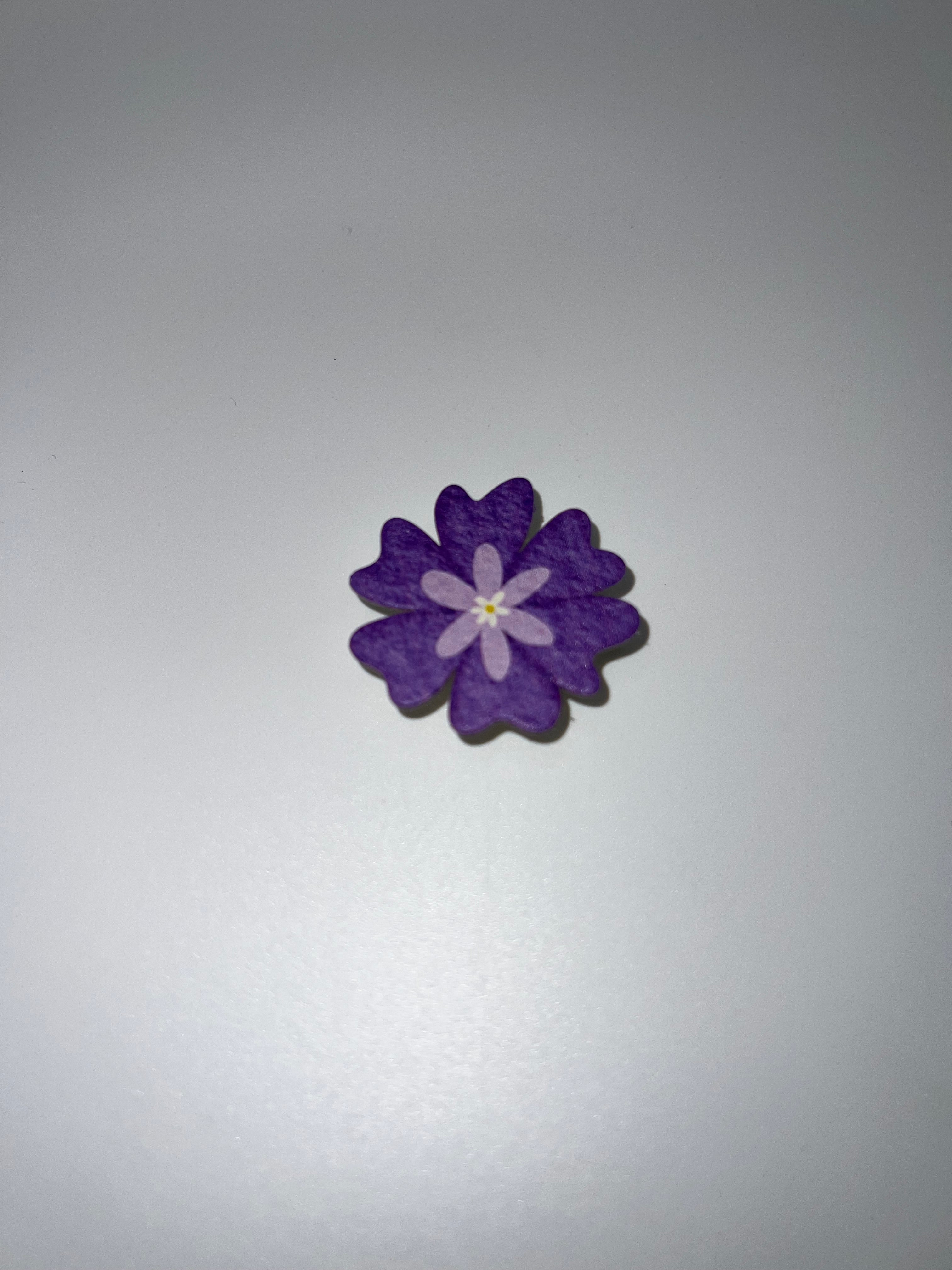 Purple flower needle minder