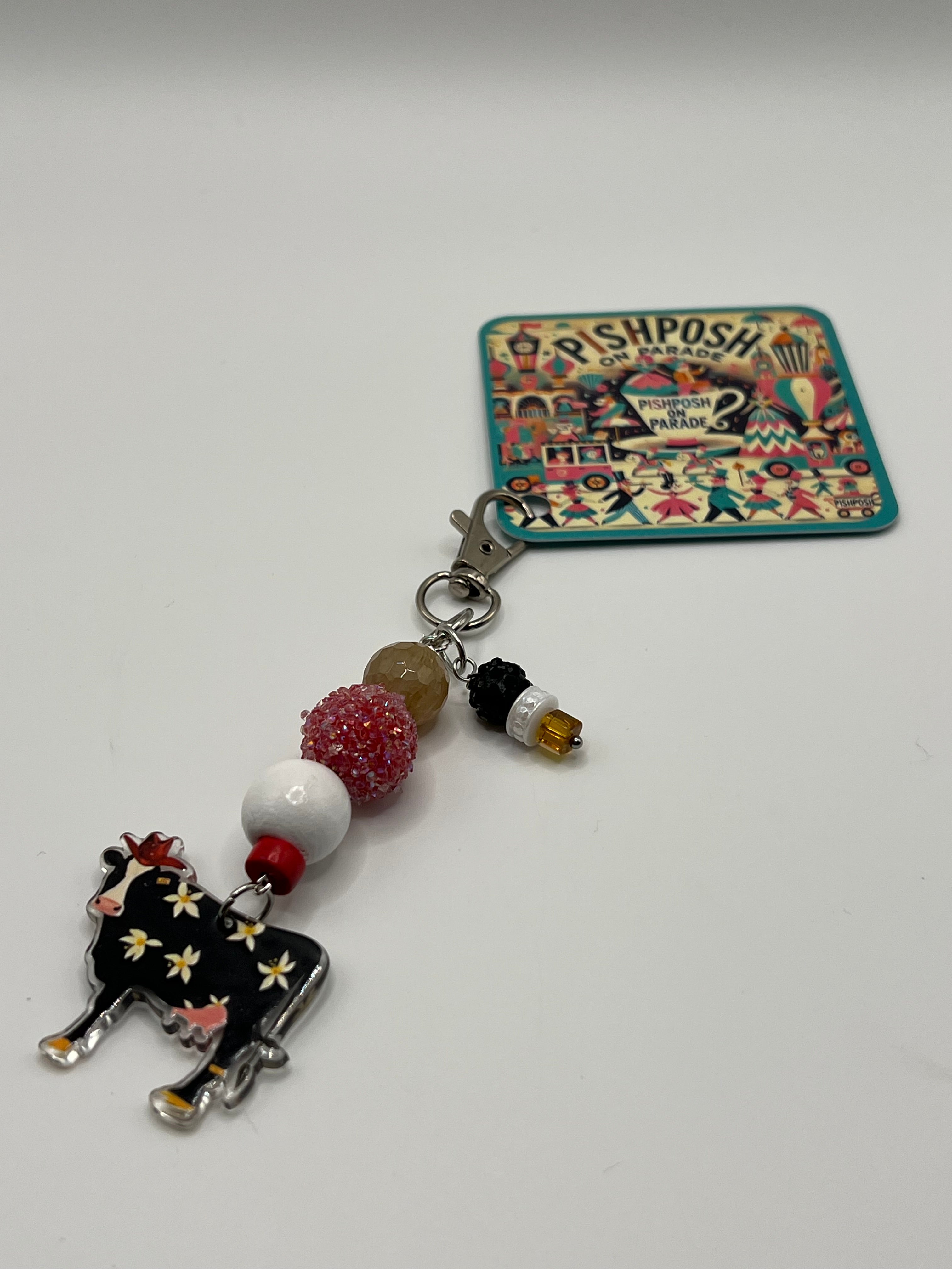 Black cow with flowers - charm