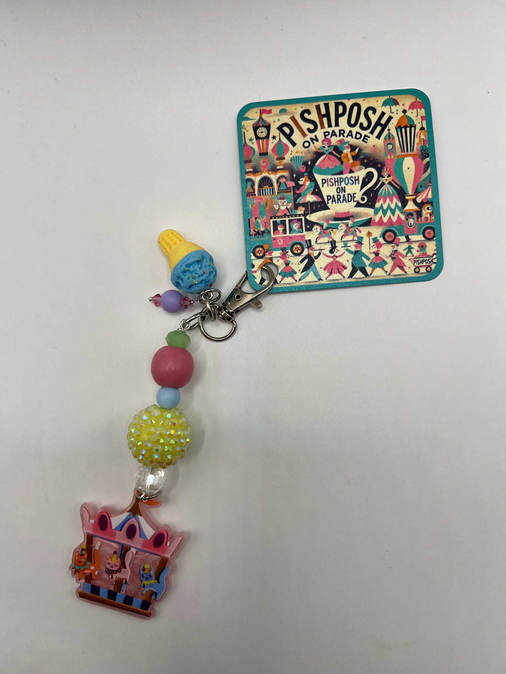 Cats on a carousel with blue ice cream charm
