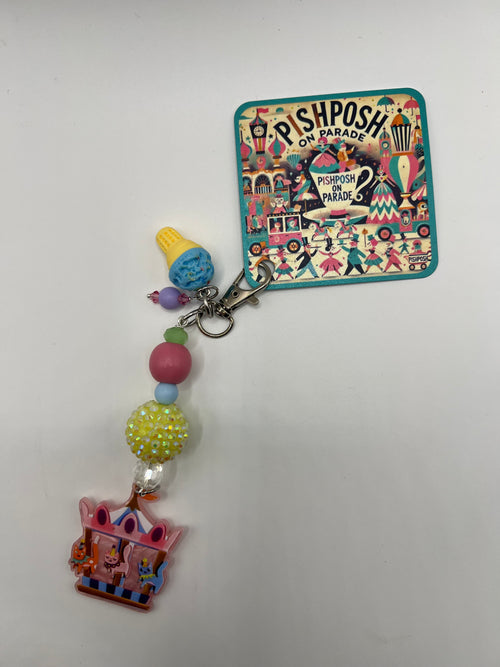 Cats on a carousel with blue ice cream charm