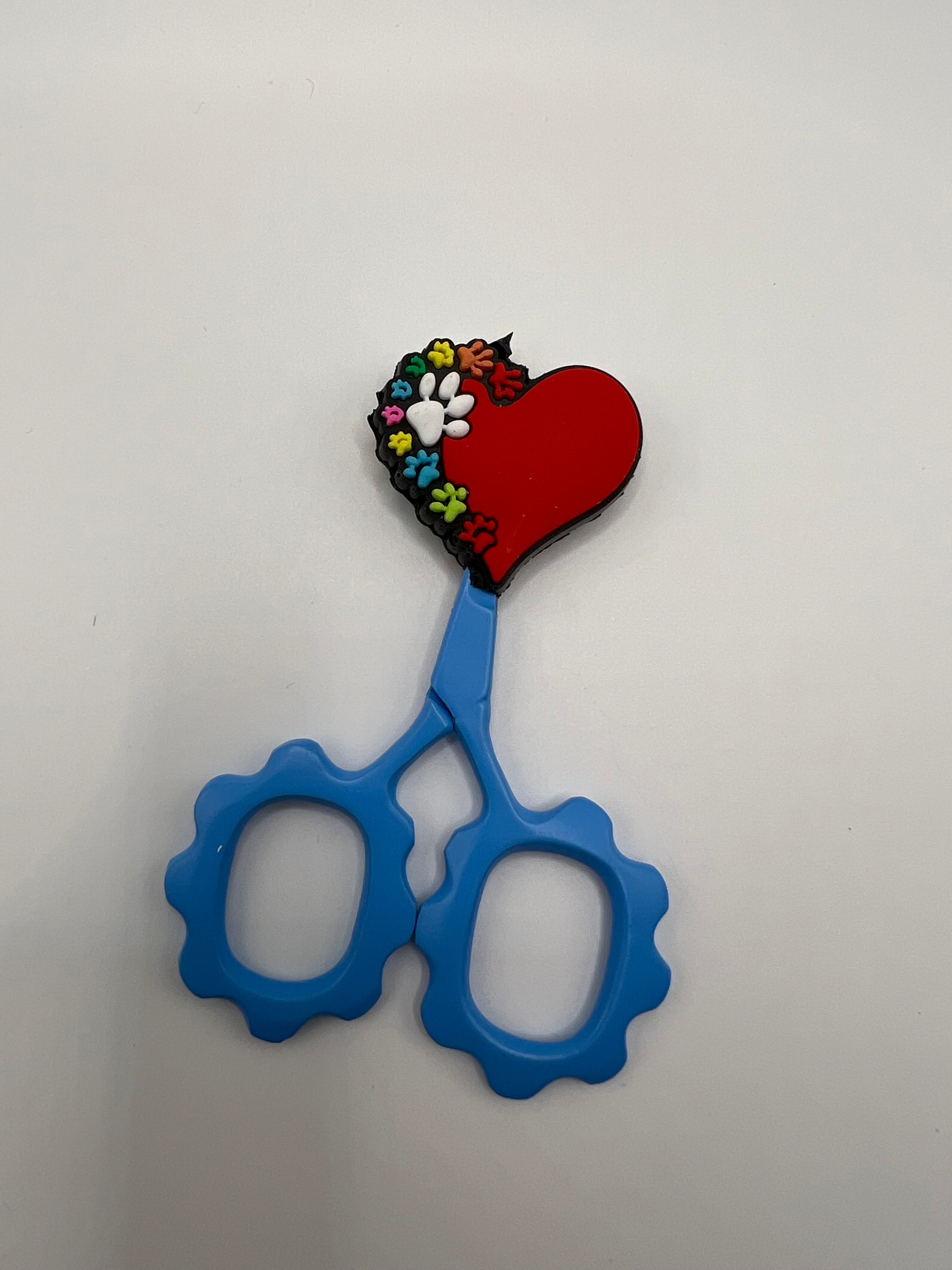 Red heart with colorful paw print scissor tip protector