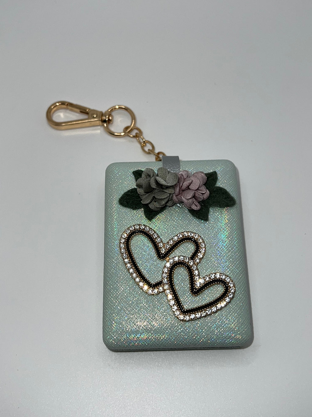 Iridescent green floral heart needle case