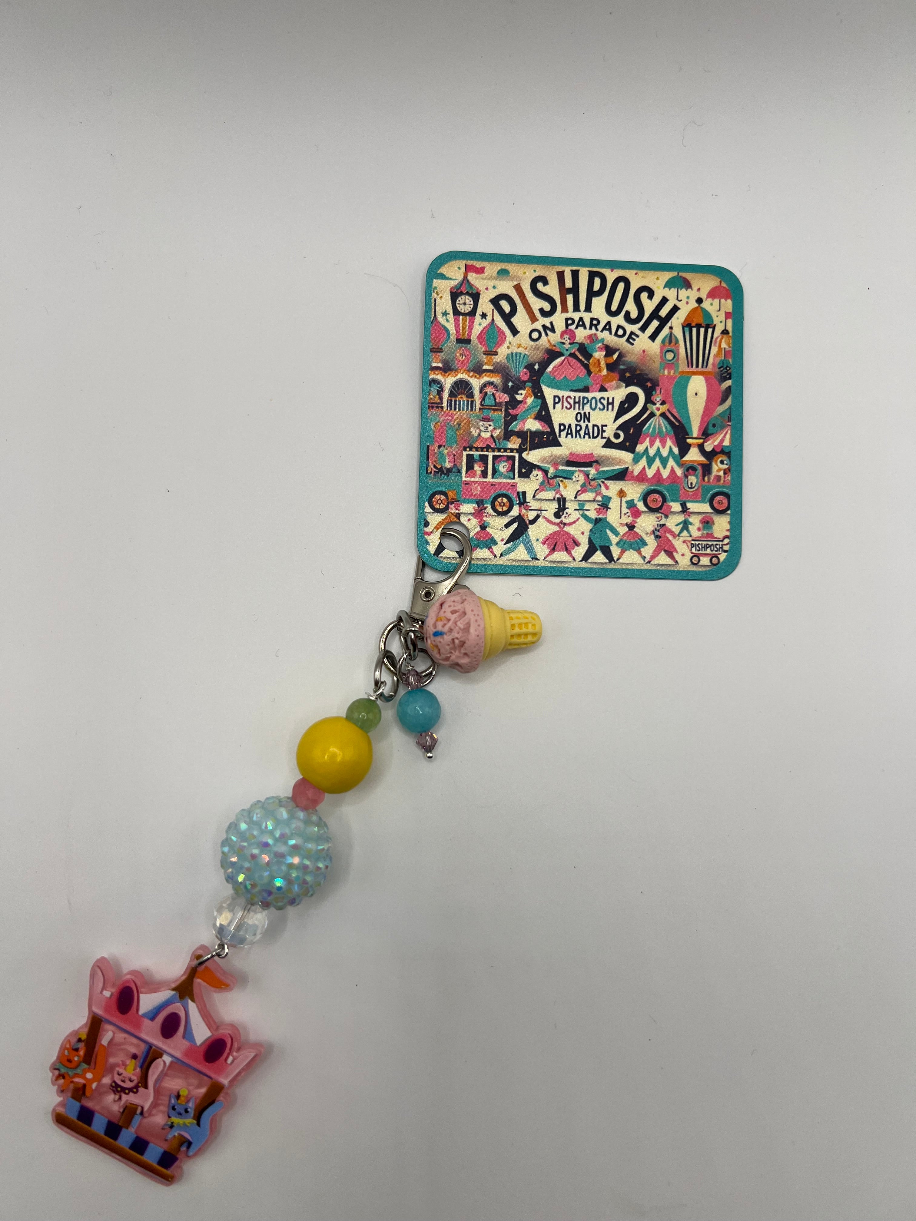 Cats on carousel with pink ice cream charm