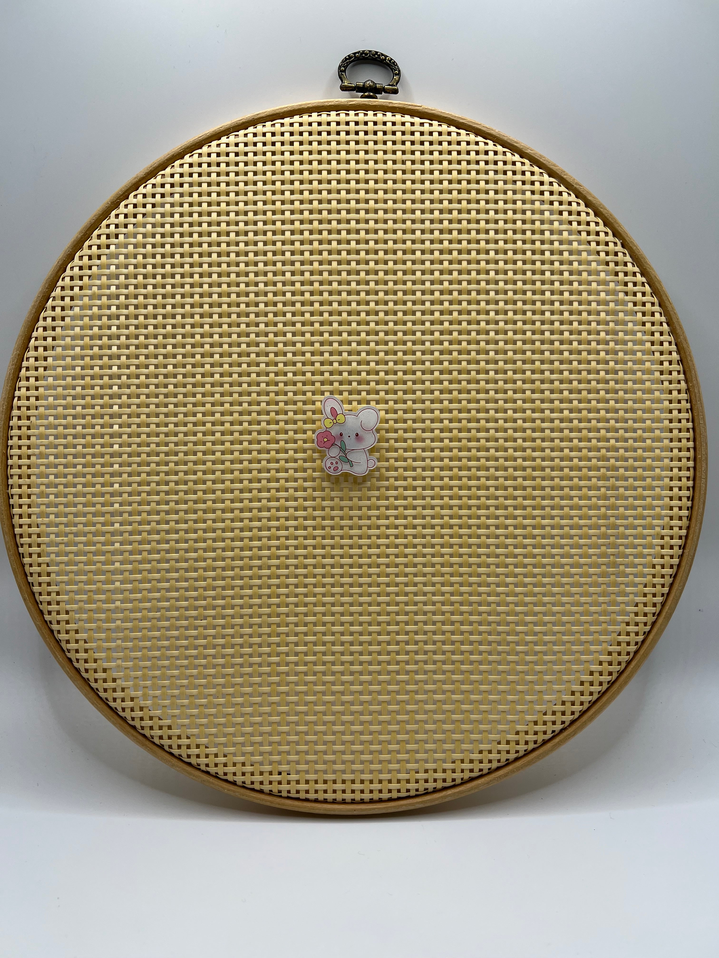 Cartoon bunny with flower needle minder
