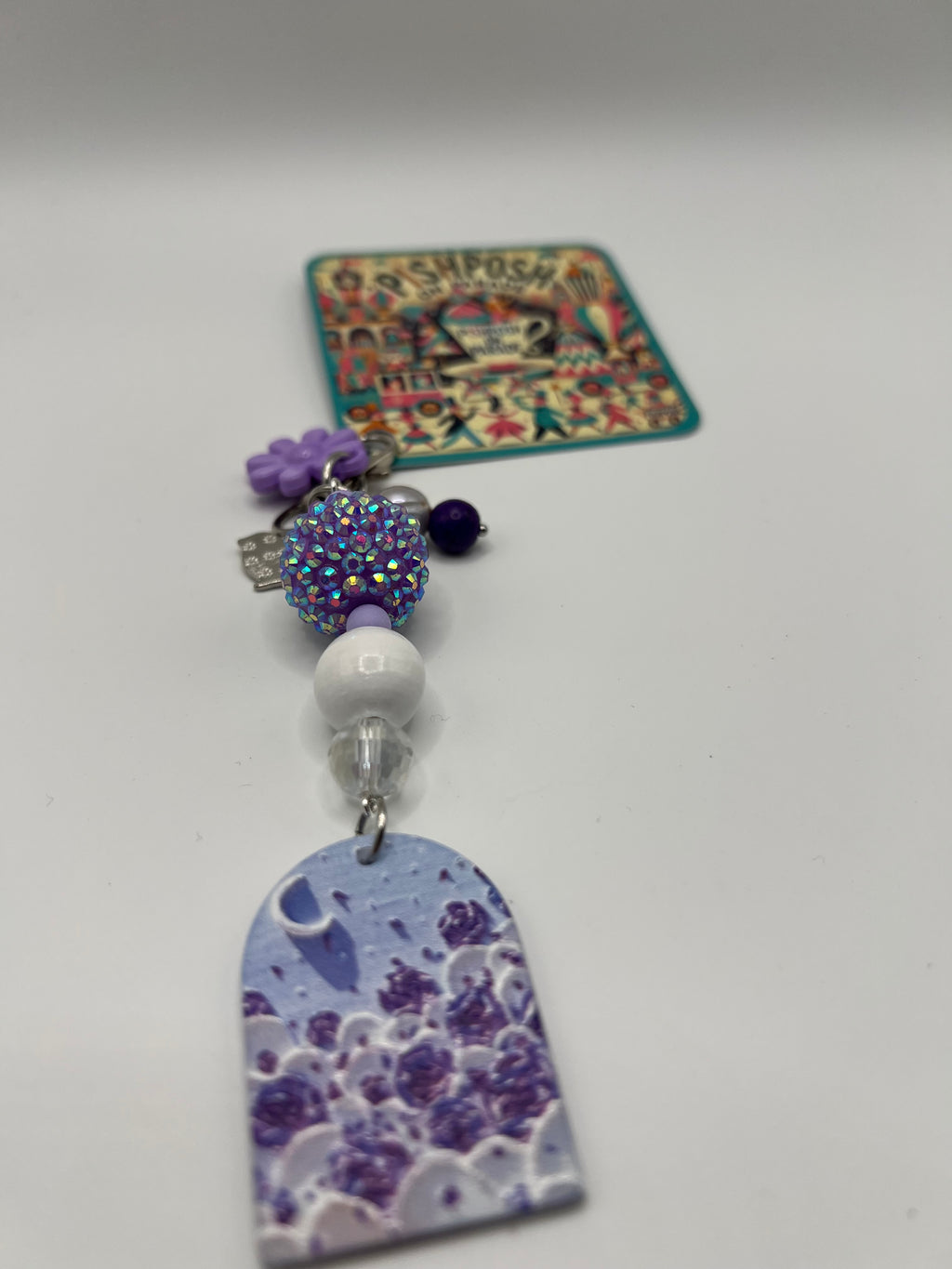 Purple window with crescent charm