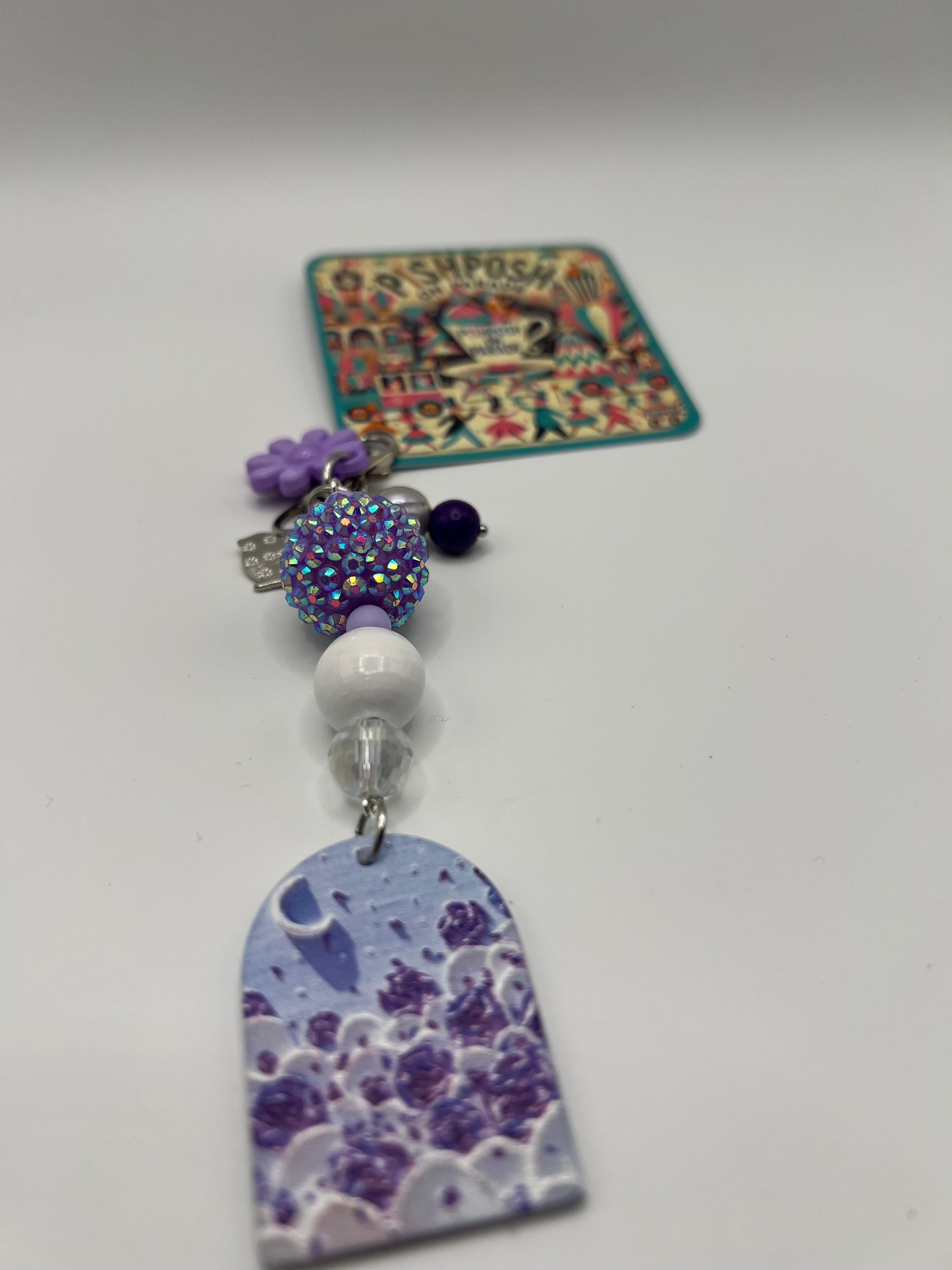 Purple window with crescent charm