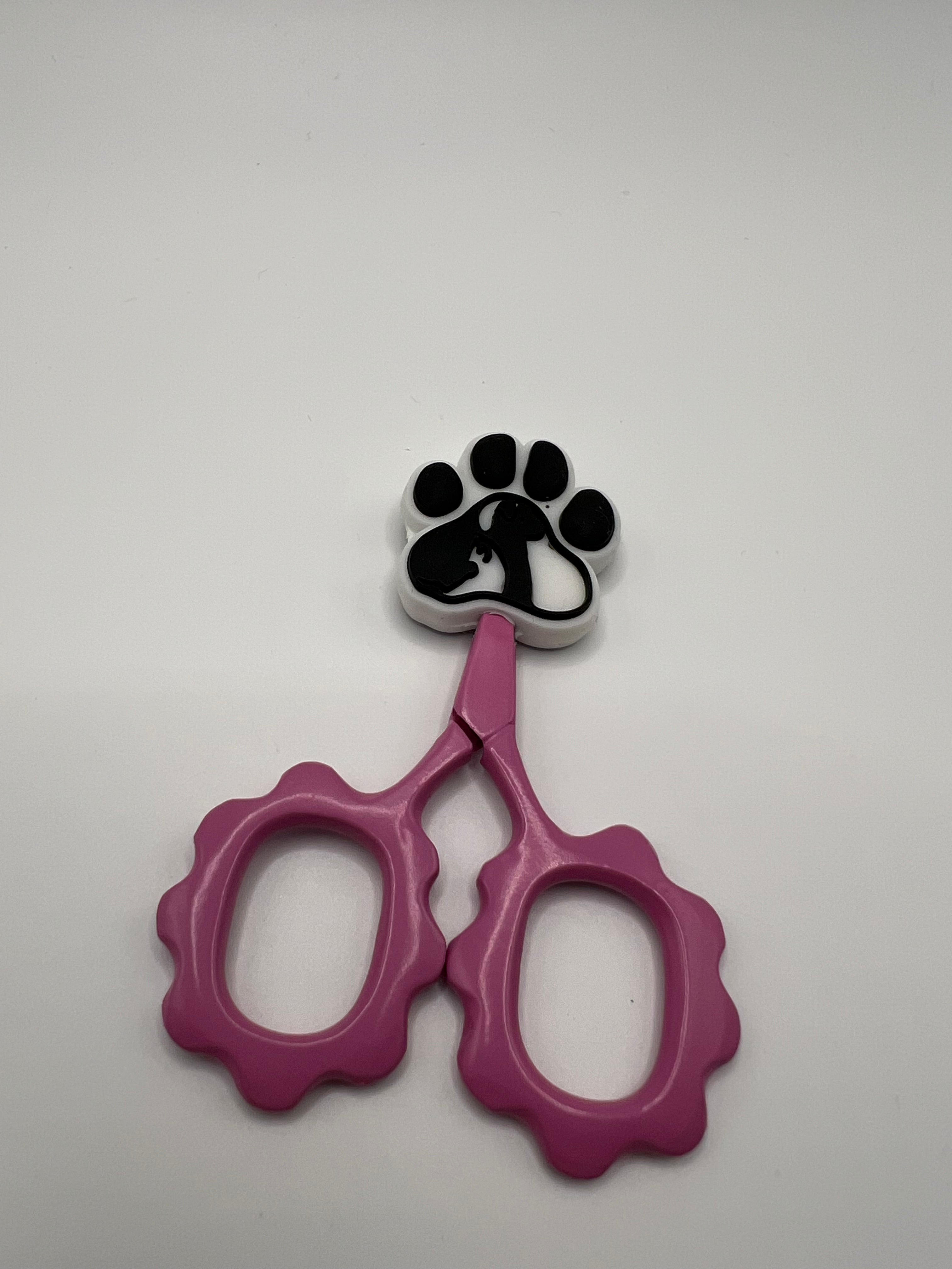 Black and white paw print with dog silhouette - scissors not included