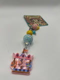 Cats on carousel with pink ice cream charm