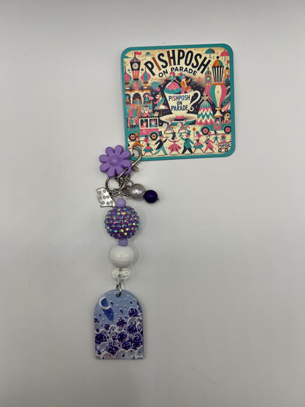 Purple window with crescent charm