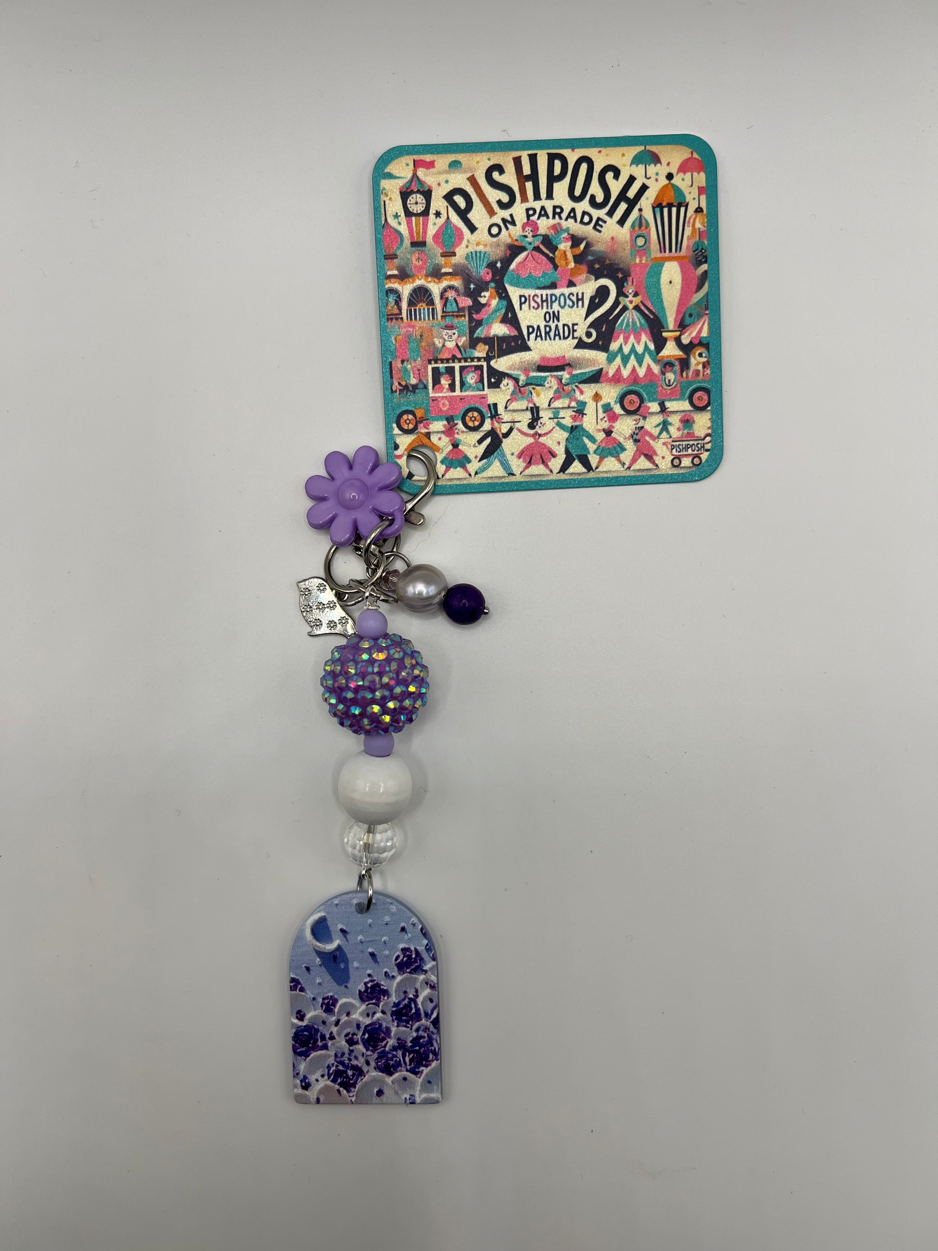 Purple window with crescent charm
