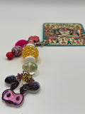 Cow with yellow and pink beads charm