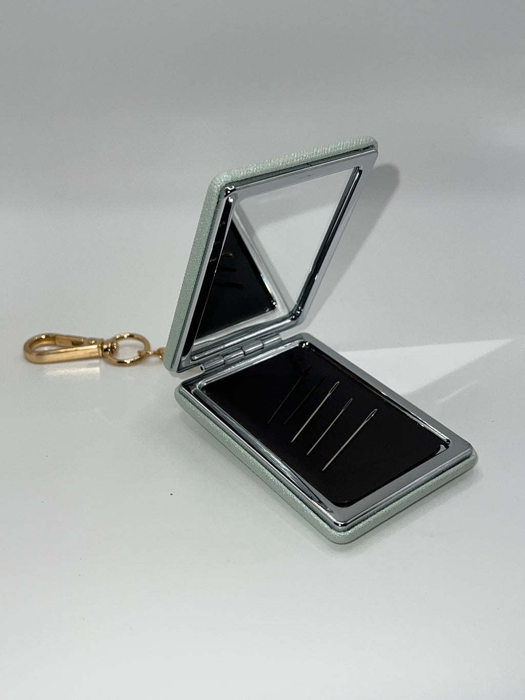 Iridescent green floral heart needle case
