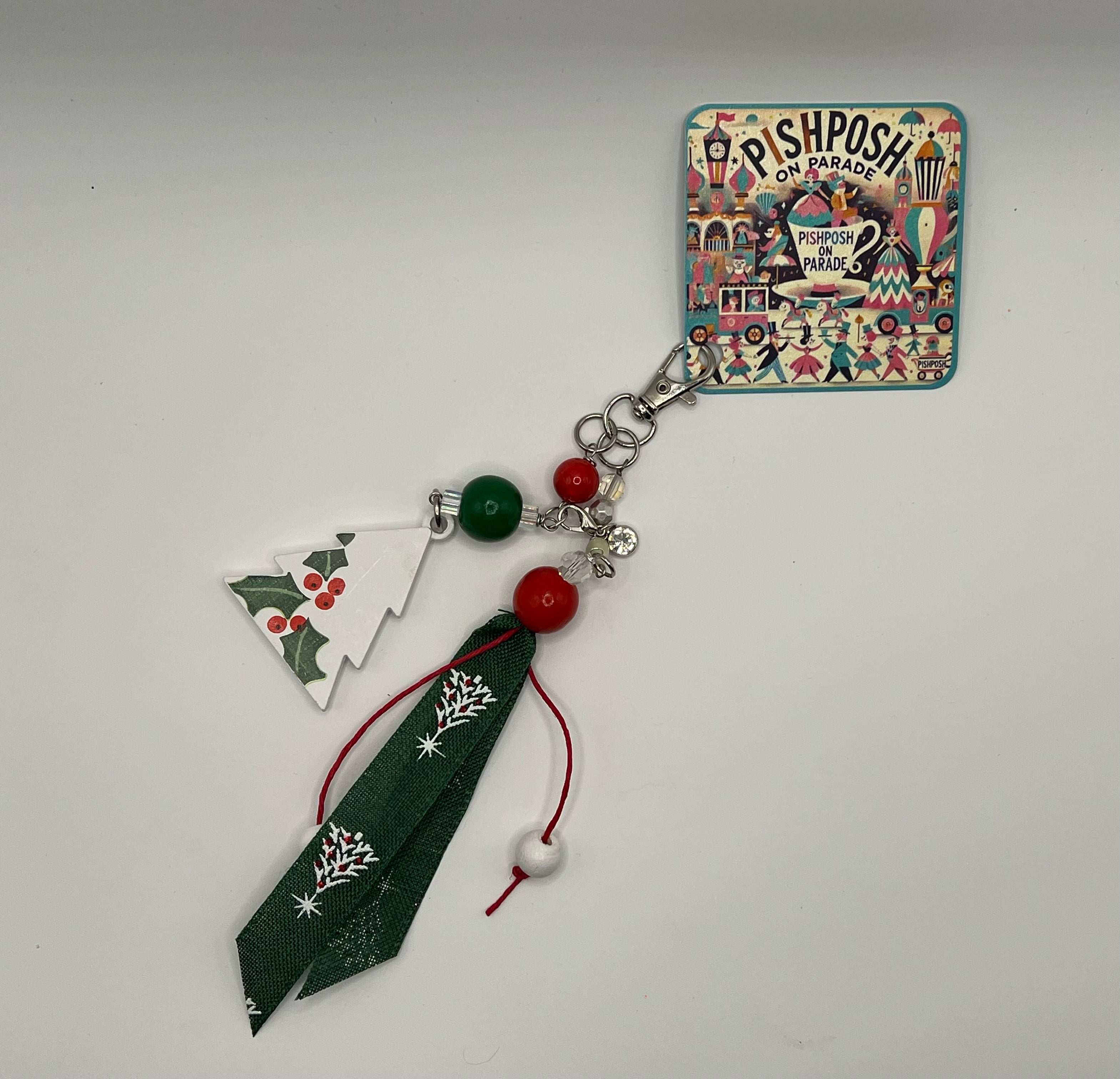 White Christmas tree with holly, green and red beads and green decorative ribbon - Charm / Bag Zipper Pull