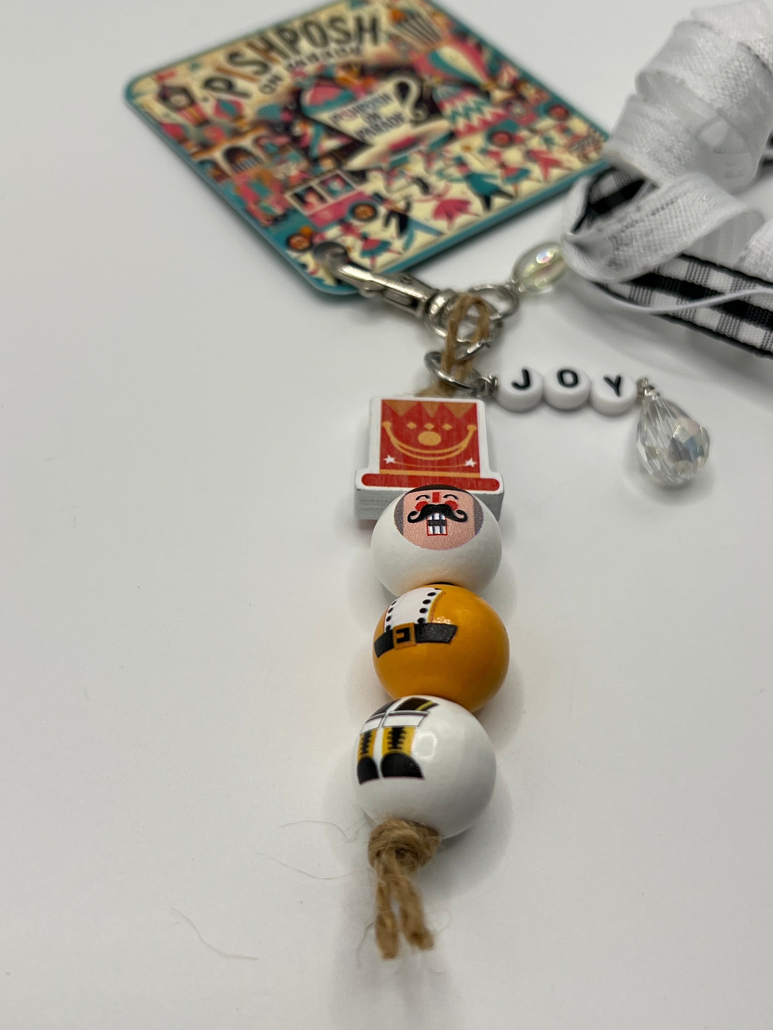 Nutcracker - “Joy” with Black and White ribbons - Charm / Bag Zipper Pull
